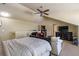 Finished attic bedroom with vaulted ceiling, ceiling fan, and sitting area near the window at 2703 Brookhavenrun Cir, Duluth, GA 30097