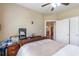 Bedroom featuring neutral decor, queen-sized bed, and access to the rest of the home at 2703 Brookhavenrun Cir, Duluth, GA 30097