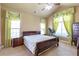 Comfortable bedroom with ample natural light, ceiling fan, and a dresser with drawers at 2703 Brookhavenrun Cir, Duluth, GA 30097