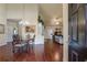 Elegant dining area with hardwood floors, chandelier, and seamless flow into the living space at 2703 Brookhavenrun Cir, Duluth, GA 30097