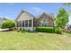 Charming home exterior with manicured lawn, stone accents, and well-maintained landscaping at 2703 Brookhavenrun Cir, Duluth, GA 30097