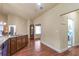 Open-concept area featuring the kitchen with stainless appliances and a view to the laundry room at 2703 Brookhavenrun Cir, Duluth, GA 30097