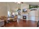 Inviting living room featuring a fireplace, built-in shelving, and hardwood floors at 2703 Brookhavenrun Cir, Duluth, GA 30097