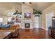 This living room boasts hardwood floors, a fireplace, and built-in shelving at 2703 Brookhavenrun Cir, Duluth, GA 30097