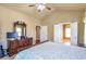 A main bedroom featuring a large bed, neutral decor, and hardwood floors at 2703 Brookhavenrun Cir, Duluth, GA 30097