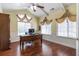 Bright and airy office space with vaulted ceilings, hardwood floors, and classic window treatments at 2703 Brookhavenrun Cir, Duluth, GA 30097