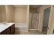 This bathroom features a double sink vanity, a soaking tub, and a separate glass door shower at 3456 Sardis Bend Dr, Buford, GA 30519