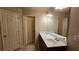 This bathroom showcases a double sink vanity, great storage, and a doorway to the water closet at 3456 Sardis Bend Dr, Buford, GA 30519