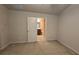 A carpeted bedroom leads to bathroom, showcasing seamless flow and functional design at 3456 Sardis Bend Dr, Buford, GA 30519