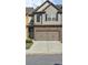 Charming two-story home features a two car garage and classic architectural details at 3456 Sardis Bend Dr, Buford, GA 30519