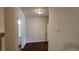 Hallway with wood floors leads to the bathroom at 3456 Sardis Bend Dr, Buford, GA 30519