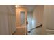 Hallway at the top of the stairs leads to bedroom at 3456 Sardis Bend Dr, Buford, GA 30519