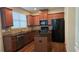 Modern kitchen with granite countertops, stainless steel appliances, a kitchen island, and abundant cabinet space at 3456 Sardis Bend Dr, Buford, GA 30519