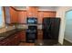 Modern kitchen with granite countertops, stainless steel appliances, an island, and ample cabinet space at 3456 Sardis Bend Dr, Buford, GA 30519