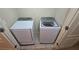 A practical laundry room featuring a full-sized washer and dryer set for easy laundry convenience at 3456 Sardis Bend Dr, Buford, GA 30519
