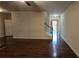Bright living room boasting hardwood floors, neutral decor, and an inviting staircase leading to the upper level at 3456 Sardis Bend Dr, Buford, GA 30519