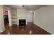 Inviting living room features a fireplace, hardwood floors, and seamless flow into the adjacent kitchen at 3456 Sardis Bend Dr, Buford, GA 30519