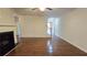 Spacious living room showcasing gleaming hardwood floors, a cozy fireplace, and neutral wall colors at 3456 Sardis Bend Dr, Buford, GA 30519
