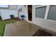 Cozy concrete patio with a blue grill, perfect for outdoor cooking and relaxation at 3456 Sardis Bend Dr, Buford, GA 30519