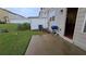Cozy concrete patio with a blue grill, perfect for outdoor cooking and relaxation at 3456 Sardis Bend Dr, Buford, GA 30519