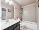 Tiled bathroom with a large tub, vanity, and updated fixtures at 3670 Casual Ridge Way, Loganville, GA 30052