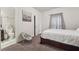 Bright bedroom featuring fresh white walls and carpeted floors with an ensuite bathroom at 3670 Casual Ridge Way, Loganville, GA 30052