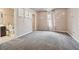 Bright bedroom with flowered wall decals, carpeted floors, and attached bathroom at 3670 Casual Ridge Way, Loganville, GA 30052