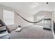 Spacious bonus room with plenty of sunlight, a hammock, and treadmill at 3670 Casual Ridge Way, Loganville, GA 30052