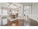 Open-concept dining area featuring coffered ceilings and beautiful hardwood floors at 3670 Casual Ridge Way, Loganville, GA 30052