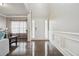 Elegant entryway with hardwood flooring, white wainscoting, and ample natural light at 3670 Casual Ridge Way, Loganville, GA 30052