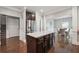 Modern kitchen with a center island, stainless steel appliances, and ample cabinet space at 3670 Casual Ridge Way, Loganville, GA 30052