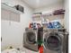 Laundry room with shelving and stainless steel washer and dryer at 3670 Casual Ridge Way, Loganville, GA 30052