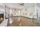 Bright living room featuring hardwood floors, a fireplace, and plush white seating at 3670 Casual Ridge Way, Loganville, GA 30052