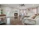 Bright living room with a fireplace, hardwood floors, and comfortable seating at 3670 Casual Ridge Way, Loganville, GA 30052