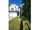 New construction home with a well-maintained front yard and a two-car garage, surrounded by lush trees at 4011 Redan Rd # 10, Stone Mountain, GA 30083