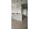 Modern kitchen with island, quartz countertops, pendant lighting and gray cabinets at 4011 Redan Rd # 10, Stone Mountain, GA 30083
