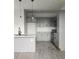 Stylish kitchen with gray cabinets, an island sink, and stainless steel appliances, ready for culinary adventures at 4011 Redan Rd # 10, Stone Mountain, GA 30083