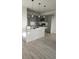 Modern kitchen featuring an island, quartz countertops, pendant lighting and gray cabinets at 4011 Redan Rd # 10, Stone Mountain, GA 30083