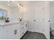 Bathroom with dual sink vanity featuring modern fixtures and tile floors at 401 Carrera Ln, Acworth, GA 30102