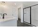 Bathroom featuring double sink vanity with granite counters and black framed walk-in shower at 401 Carrera Ln, Acworth, GA 30102