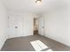 This bedroom includes closet and doorway offering views to an upper level at 401 Carrera Ln, Acworth, GA 30102
