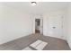 This bedroom includes closet and doorway offering views to an upper level at 401 Carrera Ln, Acworth, GA 30102