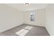 Bright bedroom features neutral carpet, paint, and natural light from a window at 401 Carrera Ln, Acworth, GA 30102