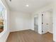 Bedroom with hardwood floors, natural light, walk-in closet, and ensuite bathroom at 401 Carrera Ln, Acworth, GA 30102