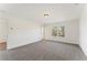 Spacious bedroom featuring neutral carpet, natural light, and a walk-in closet at 401 Carrera Ln, Acworth, GA 30102