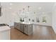 Bright kitchen with modern gray cabinets, island, stainless appliances, and hardwood floors at 401 Carrera Ln, Acworth, GA 30102