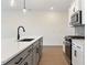 Stylish kitchen featuring modern appliances, a breakfast bar, and ample counter space at 401 Carrera Ln, Acworth, GA 30102