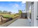 Back patio with views of well-manicured lawn and community landscape at 401 Carrera Ln, Acworth, GA 30102