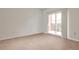 Cozy bedroom with neutral carpet and access to a private balcony with a black metal railing at 525 Parkway Dr # 218, Atlanta, GA 30354