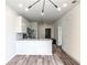 Compact, eat-in kitchen featuring stainless steel appliances, white cabinets, and wood-look flooring at 525 Parkway Dr # 218, Atlanta, GA 30354